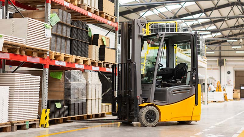 Forklift truck in warehouse